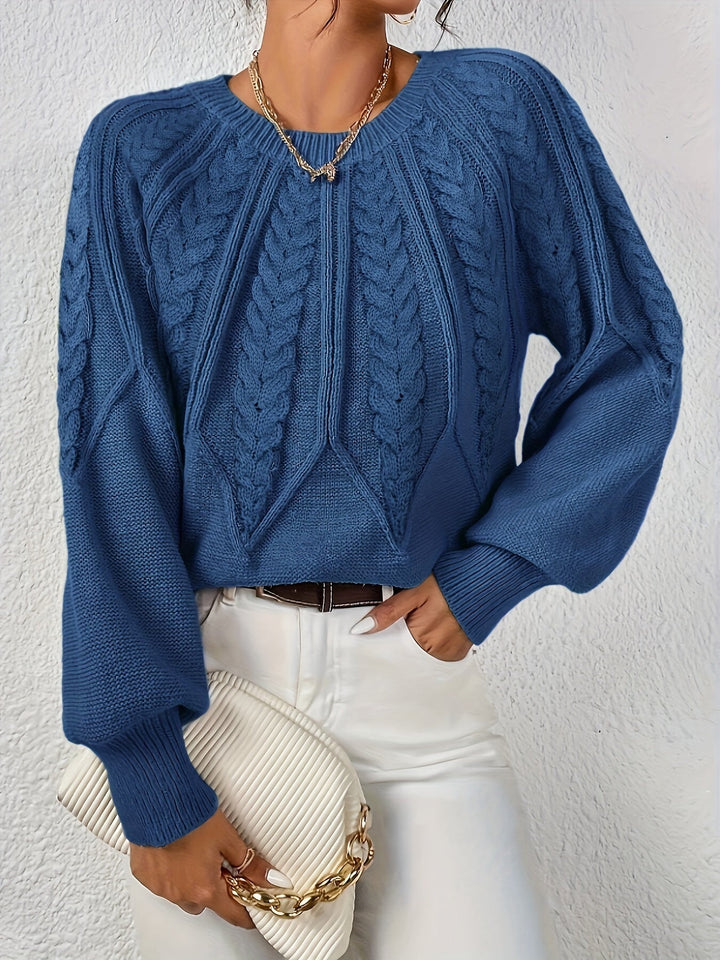 Cozy women's sweater, cable knit design, relaxed fit, ideal for everyday wear.