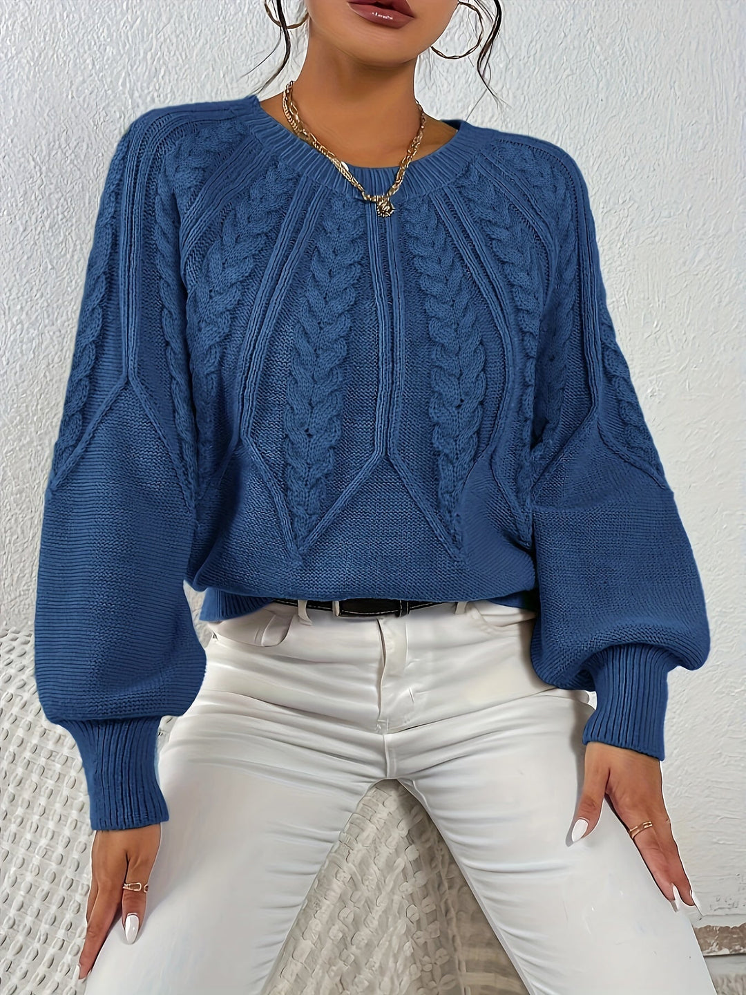Women's cable knit top, relaxed fit, lantern sleeves, perfect for winter warmth.