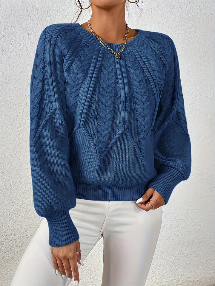 Chic women's sweater with intricate cable knit, relaxed fit, and balloon sleeves.
