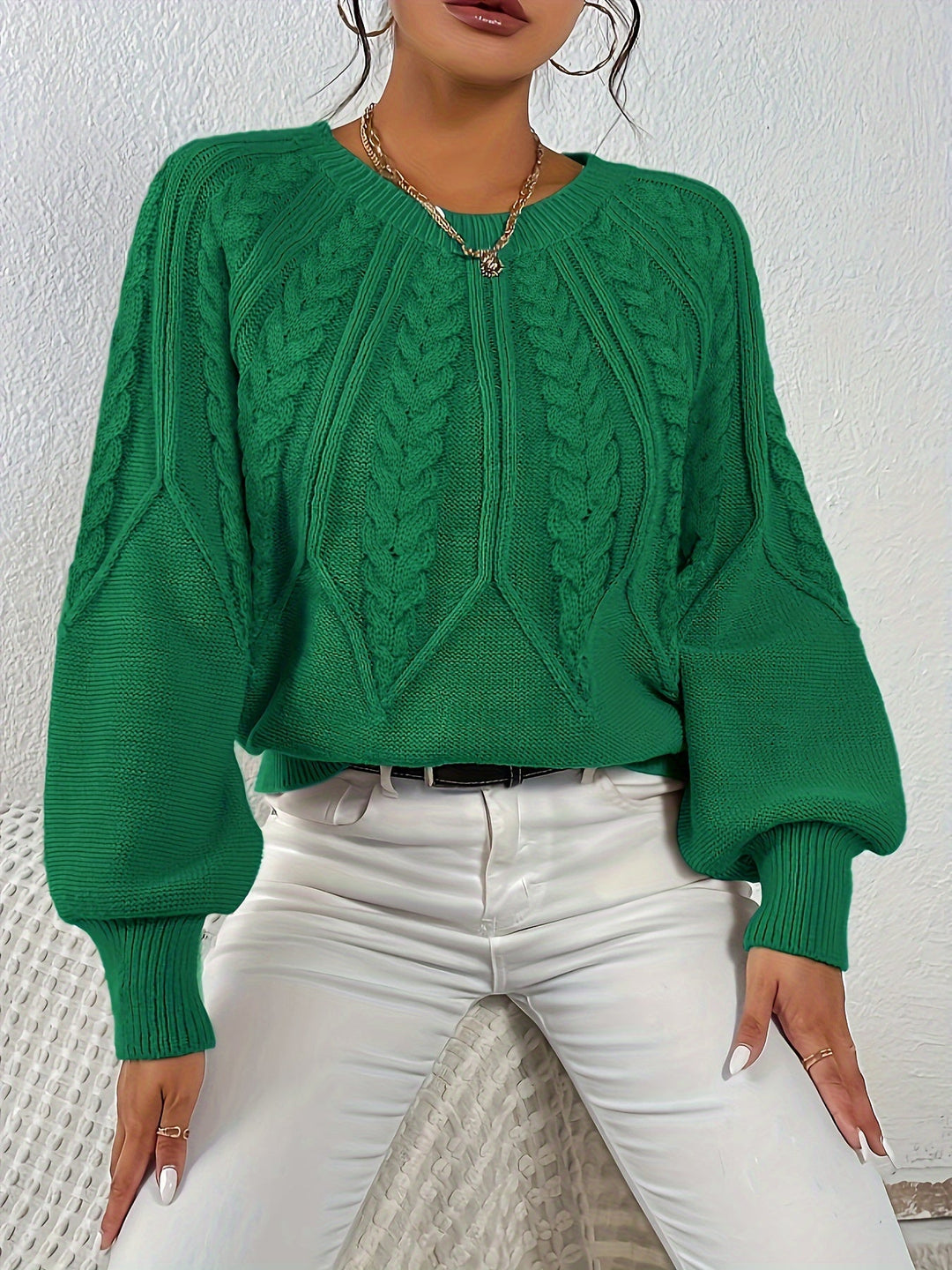 Relaxed fit women's cable knit sweater, a versatile and stylish everyday top.