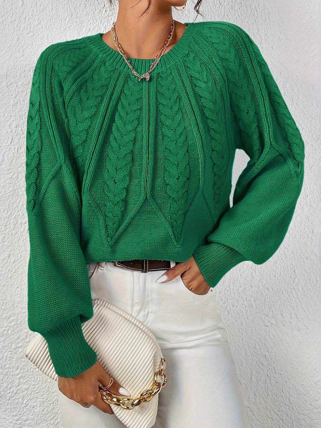 Cable knit women's sweater, cozy and chic with relaxed fit and lantern sleeves.