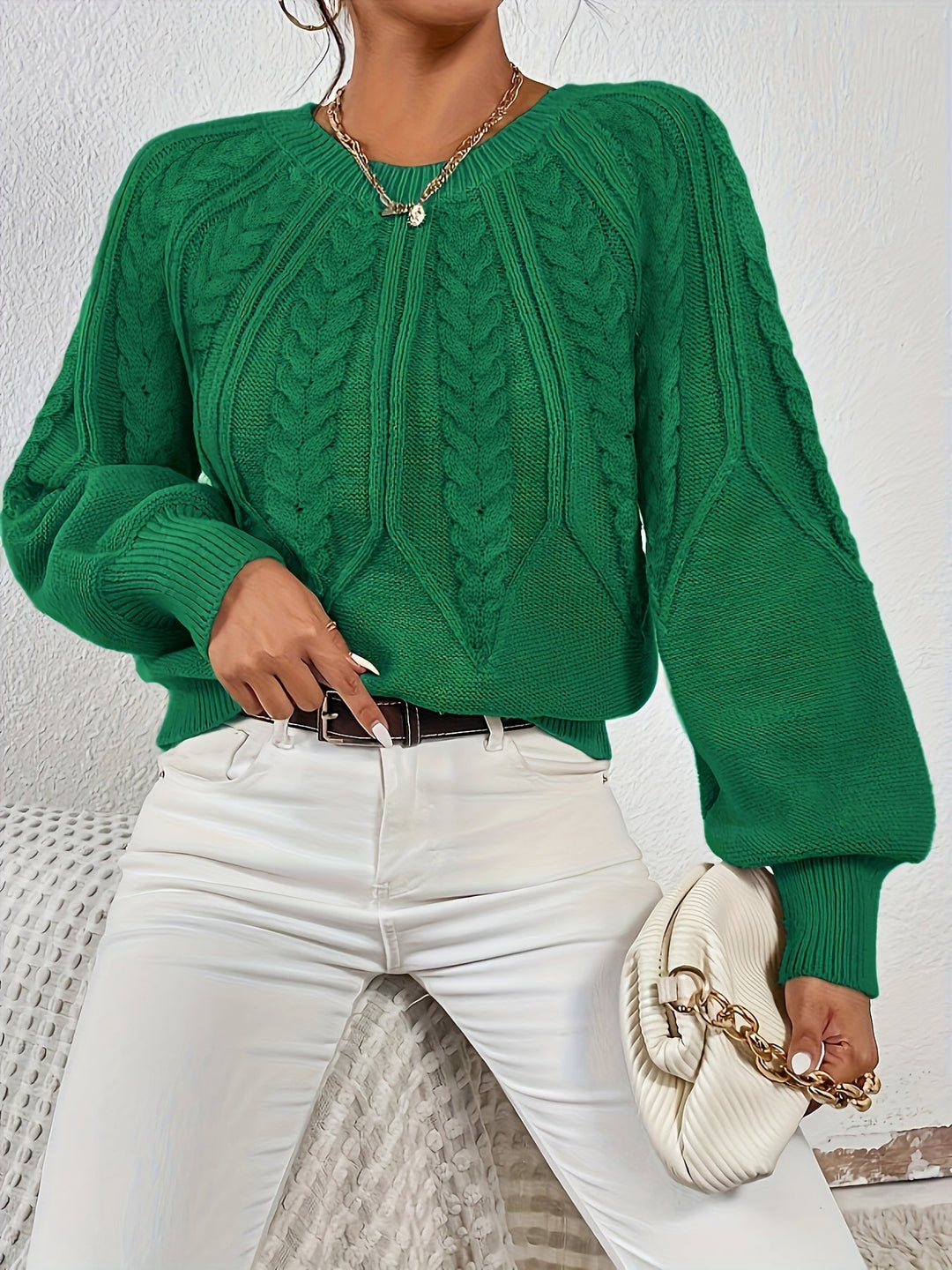 Women's stylish knit, cable pattern, relaxed fit, elegant lantern sleeves.