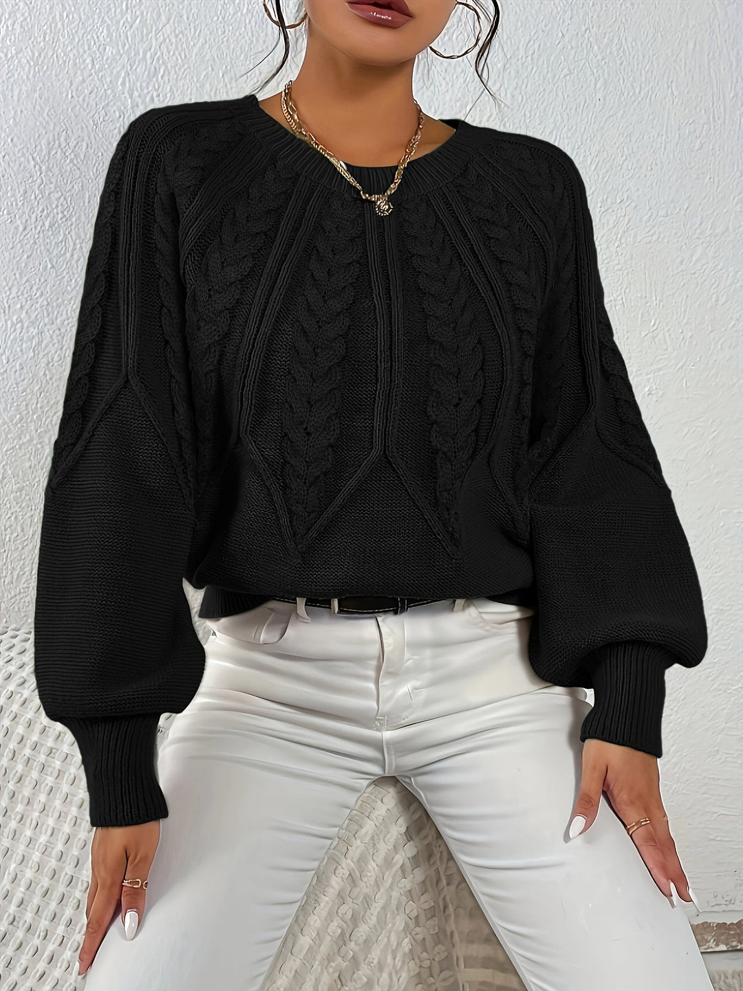 Chic women's pullover, cable knit, relaxed fit, lantern sleeves, perfect for warmth.