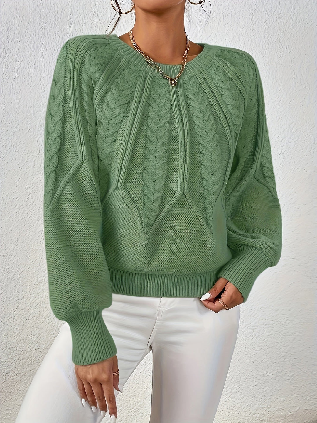 Cozy women's cable knit pullover, relaxed fit, perfect for fall & winter warmth.