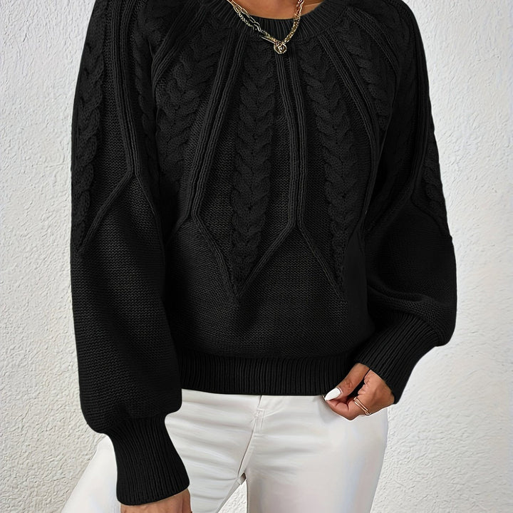 Elegant women's cable knit top, relaxed fit, lantern sleeves, ideal for cooler days.