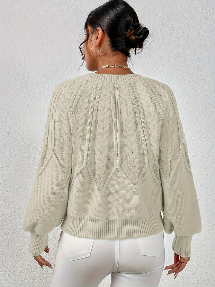Fall fashion women's cable knit sweater with relaxed fit, cozy lantern sleeves.