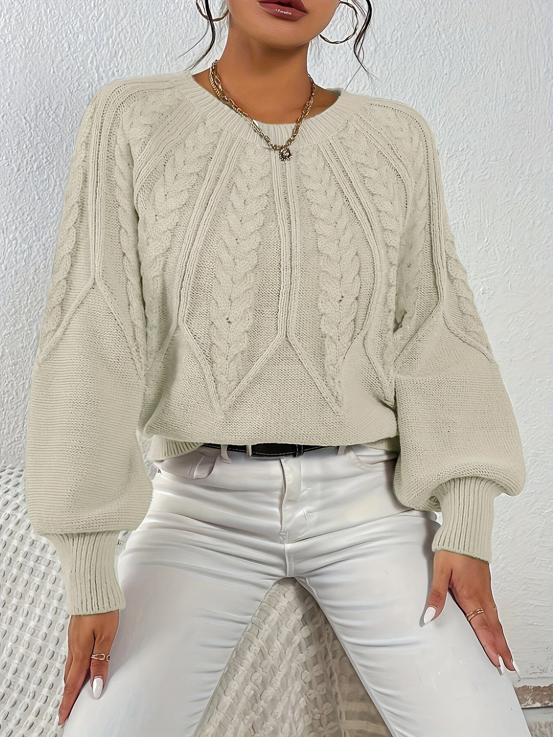 Winter warmth women's cable knit pullover, relaxed fit, chic lantern sleeves.