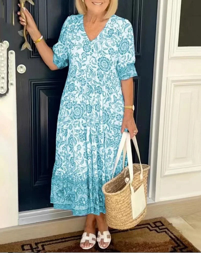 Stylish women's spring floral V-neck A-line dress, suitable for various occasions and events.