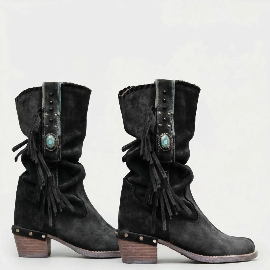 Boho-chic women's Caroline mid-calf western boots with distinctive fringe and slouchy silhouette.