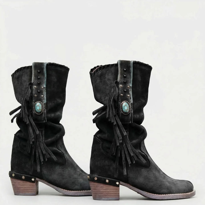 Boho-chic women's Caroline mid-calf western boots with distinctive fringe and slouchy silhouette.