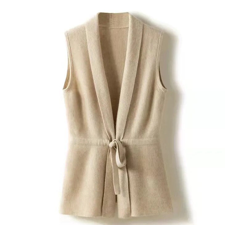 Close-up of the elegant belt closure on a women's cashmere blend knit vest