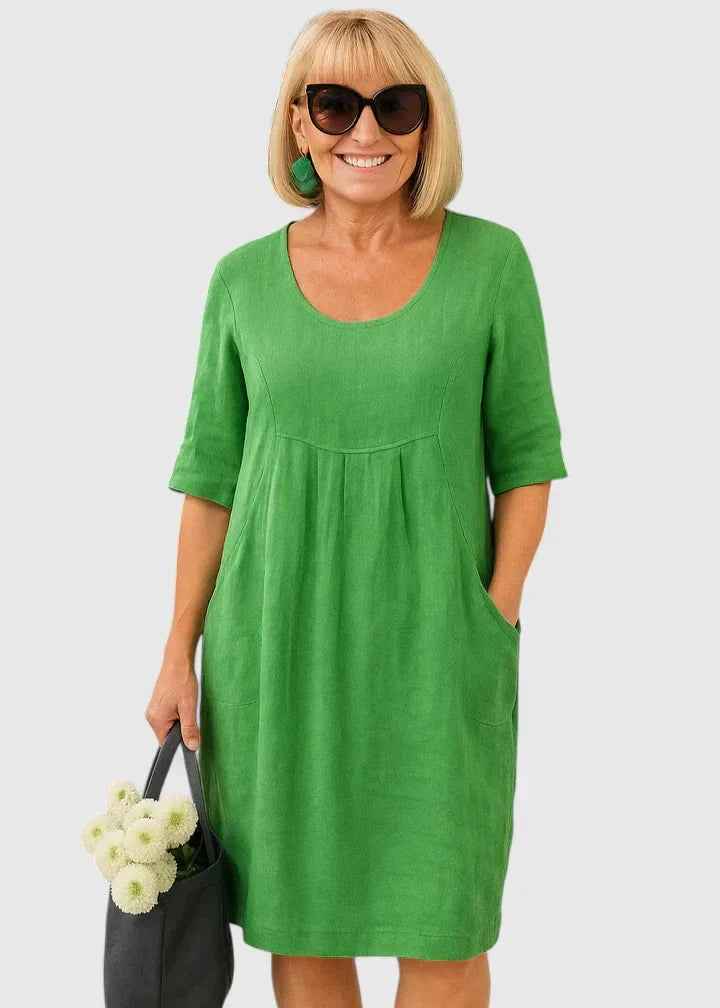 Women's casual A-line summer midi dress with practical pockets, scoop neck. Comfortable & versatile everyday wear.