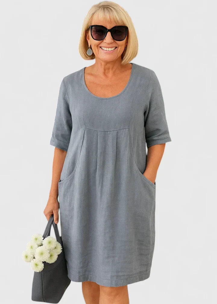 Chic women's casual A-line midi summer dress. Features a flattering scoop neck & functional pockets. Ideal for daily wear.