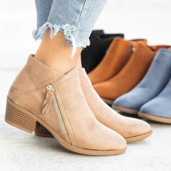Stylish pointed toe women's ankle boots with a chic block heel and easy side zip, perfect for versatile fashion.