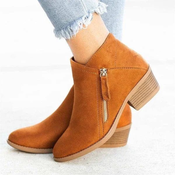 Versatile ladies' ankle boots with a sturdy block heel, side zip, and pointed toe for casual yet elegant looks.