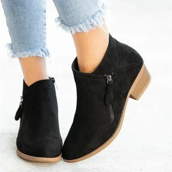Modern women's side zip ankle boots with a fashionable block heel, great for effortless casual everyday style.