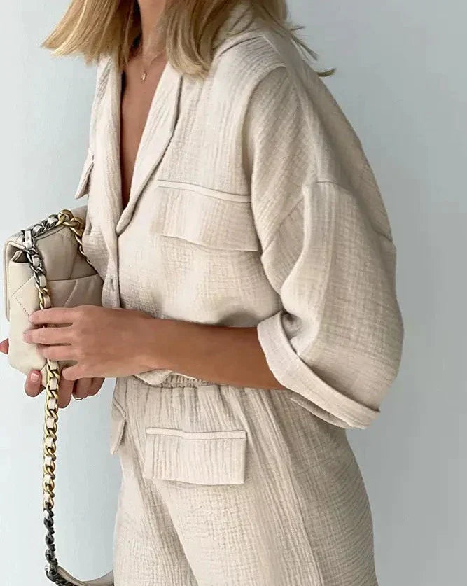 Coordinated women's two-piece shorts set with a casual button-down top, versatile for summer and lounge wear.