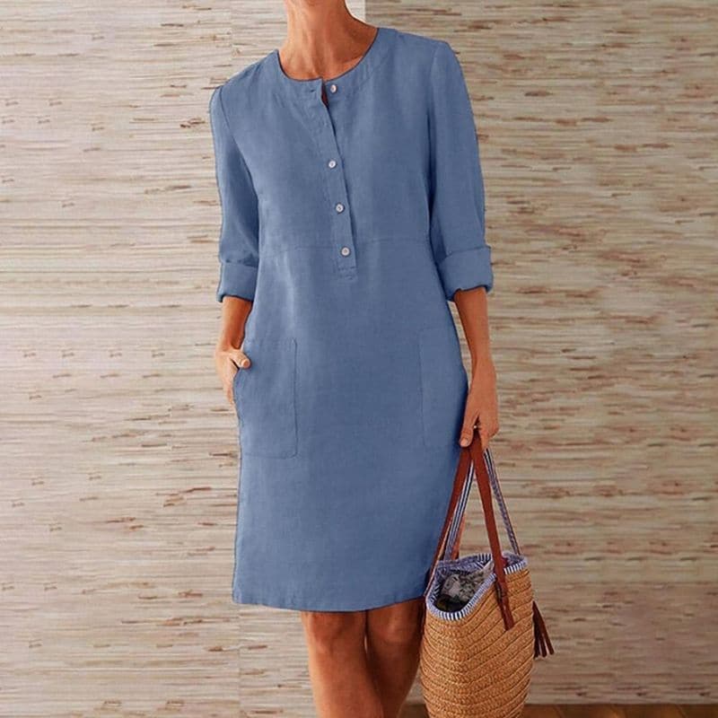 Comfortable women's shift dress with 3/4 sleeves & front buttons. Versatile midi length, ideal for spring fashion.