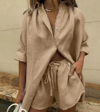 Stylish women's two-piece shorts set with button-up top and elastic waist shorts. Ideal for summer fashion.