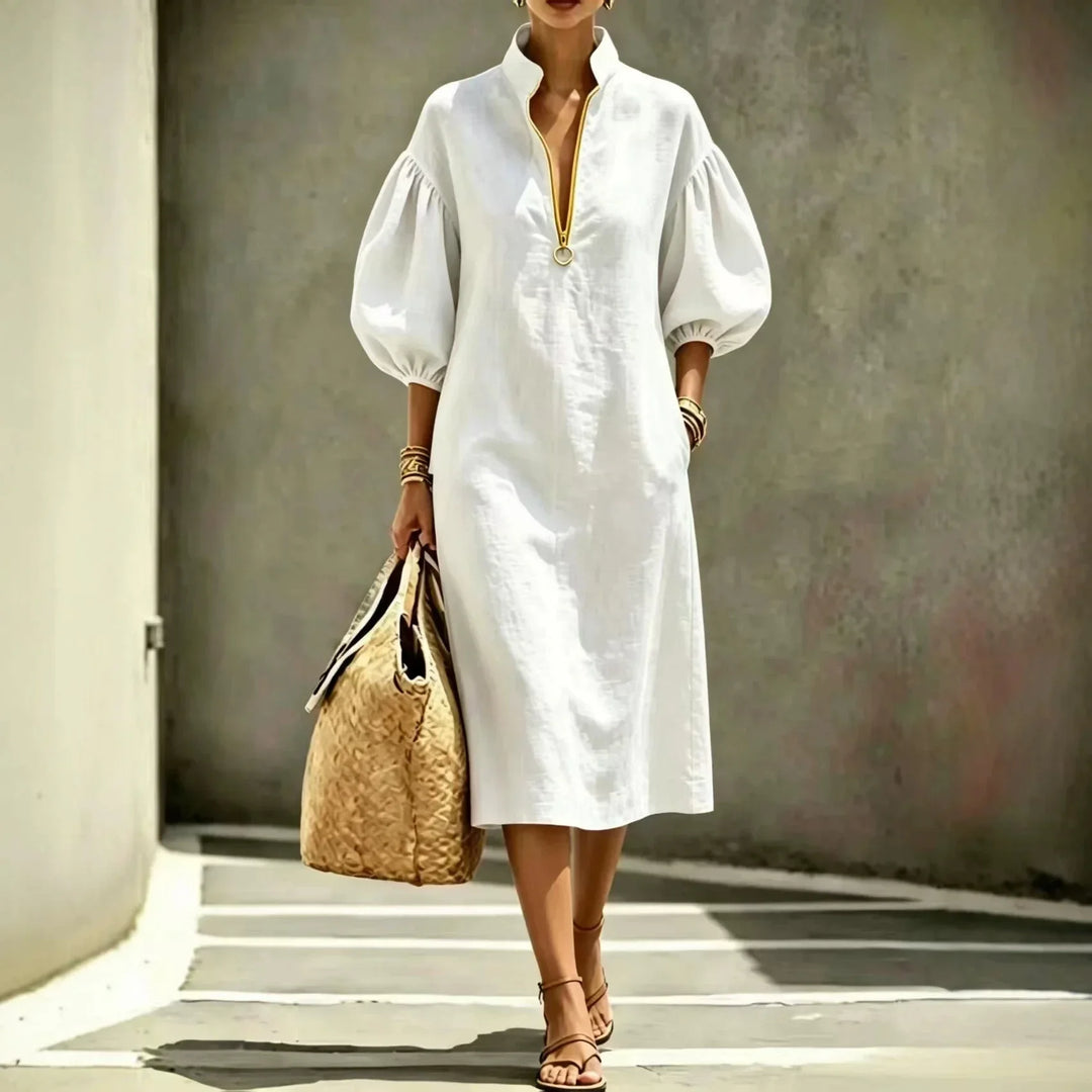 Chic women's midi dress with unique bubble sleeves, half-zip stand collar, and relaxed fit for versatile casual wear.