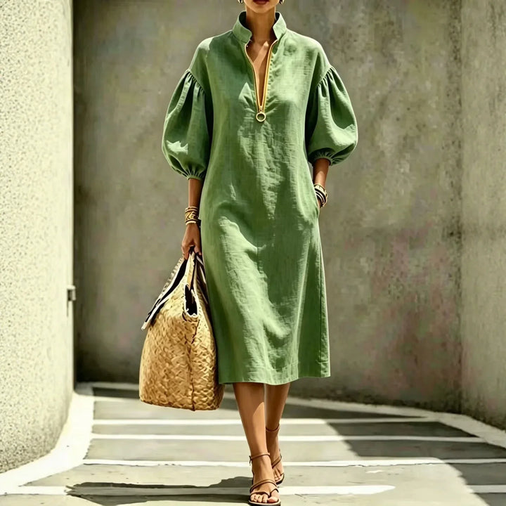 Relaxed fit women's midi dress, casual chic style with bubble sleeves & half-zip, suitable for work or weekend wear.