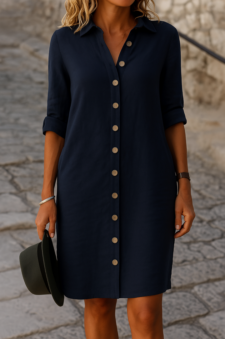Women's collared day dress, knee-length, with button front & versatile roll tab sleeves.