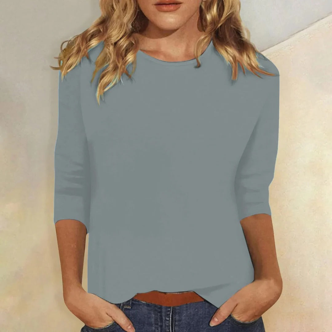 Fashionable women's crew neck top, featuring 3/4 sleeves and a relaxed fit for comfortable casual wear.