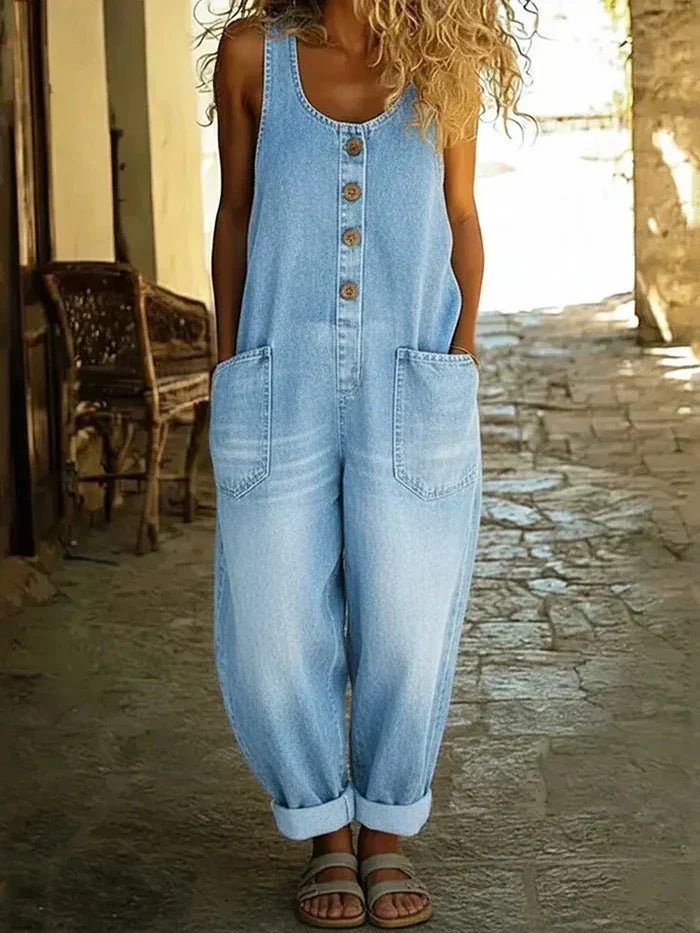 Women's casual denim jumpsuit with scoop neck, sleeveless design, and loose tapered fit. Perfect for summer everyday wear.