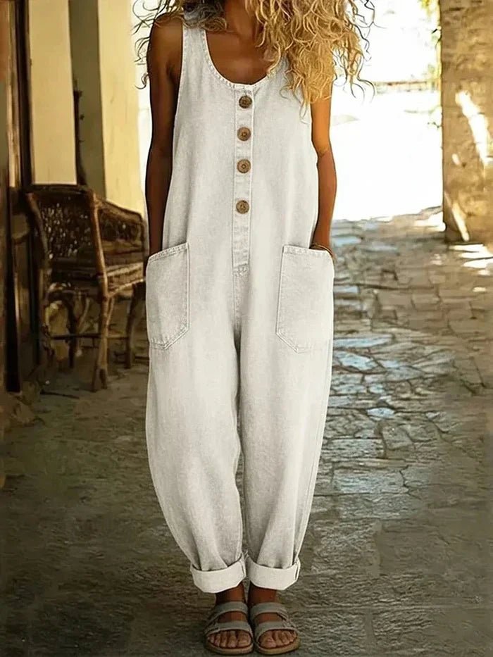 Versatile women's casual denim jumpsuit. Sleeveless, scoop neck, loose fit for comfortable everyday summer fashion.