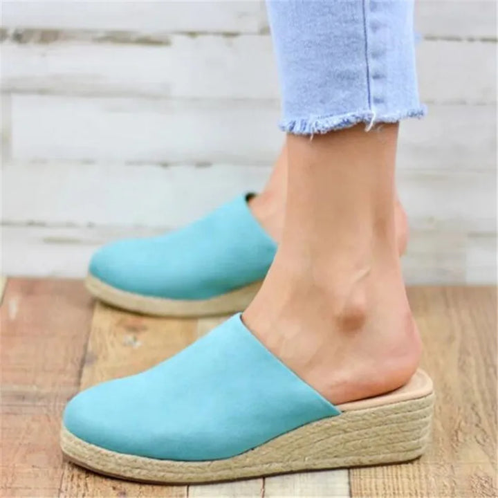 Comfortable women's everyday sandals with a fashionable flat design. Perfect slip-on footwear for casual summer style.