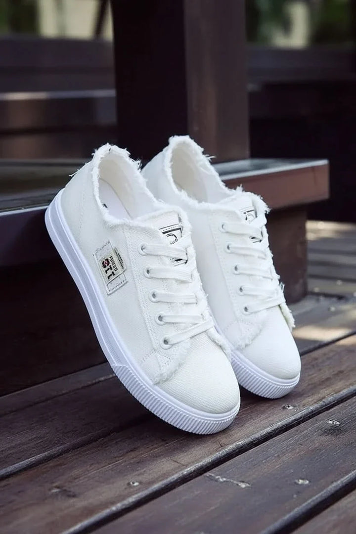 Fashionable women's high-top sneakers, lace-up design for streetwear & casual outfits.