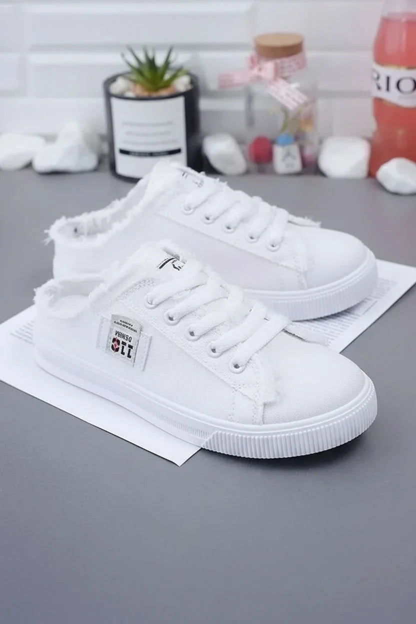 Stylish women's high-top lace-up sneakers, classic design for comfortable casual wear.
