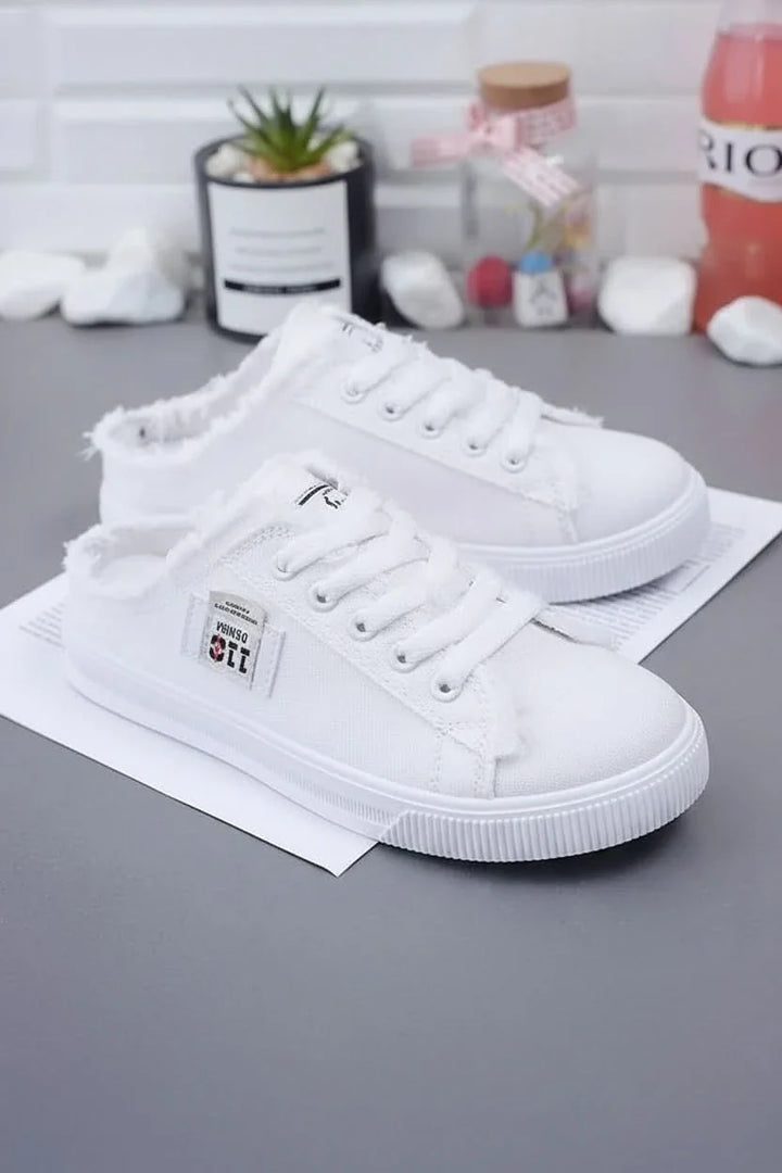 Stylish women's high-top lace-up sneakers, classic design for comfortable casual wear.