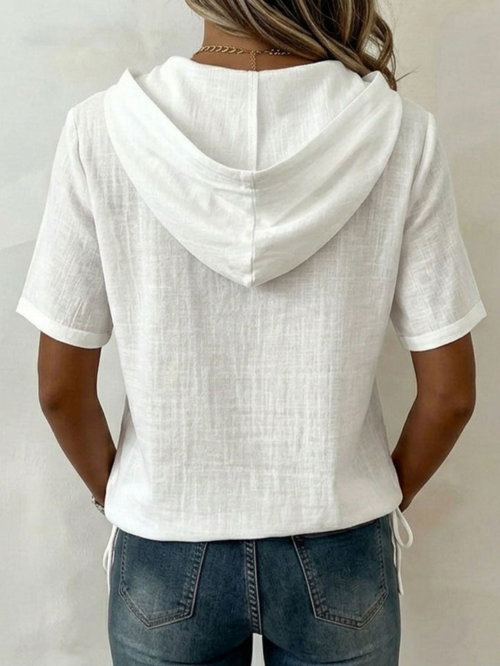 Versatile women's button-front hooded shirt, long sleeve, relaxed fit, ideal casual top for spring.