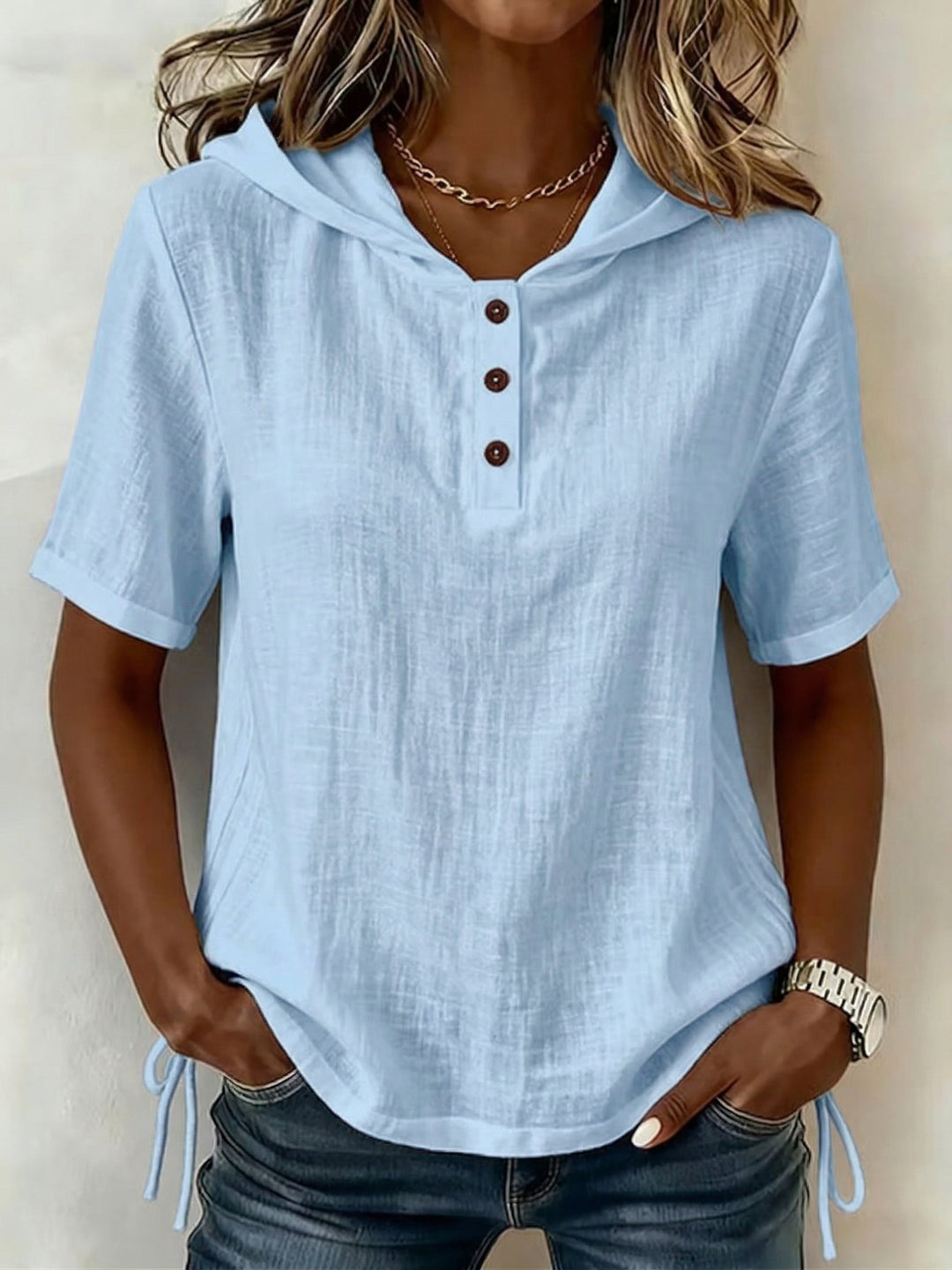 Women's relaxed fit long-sleeve hooded button shirt, a comfortable casual top for everyday spring wear.