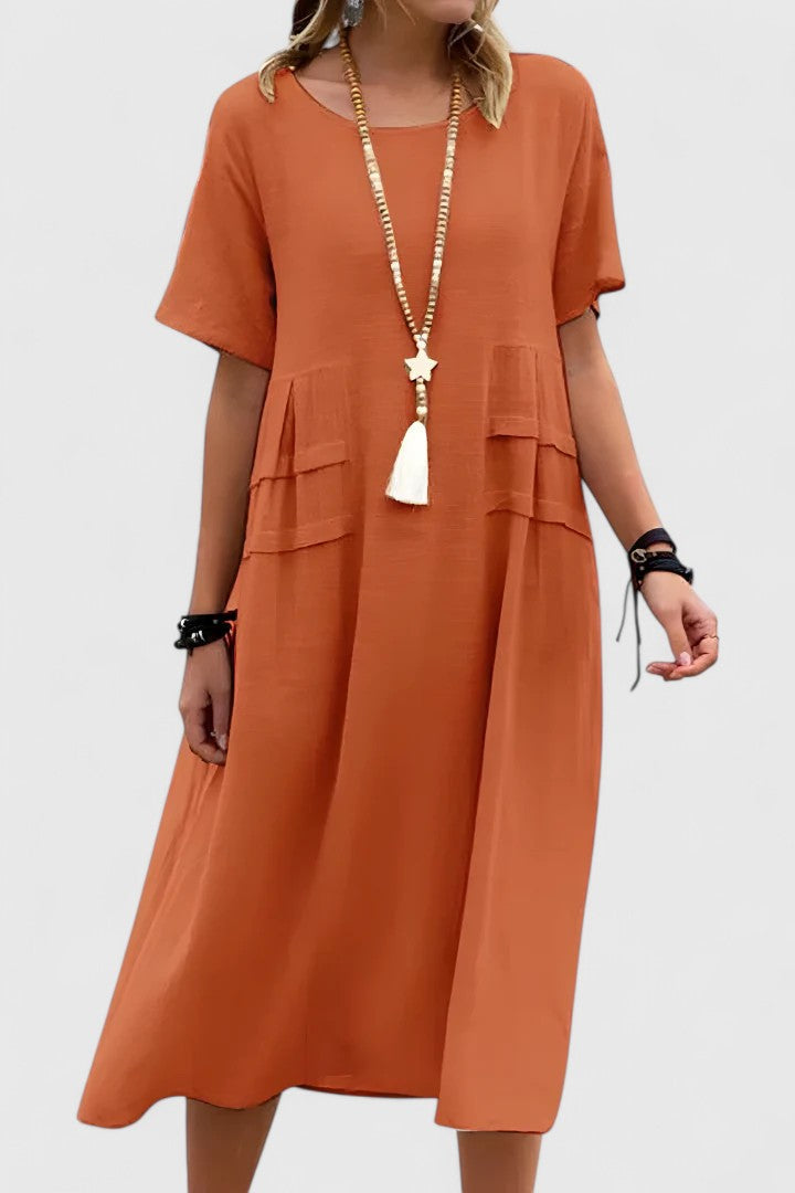 Women's casual loose fit midi dress with practical pockets, perfect for summer everyday wear.