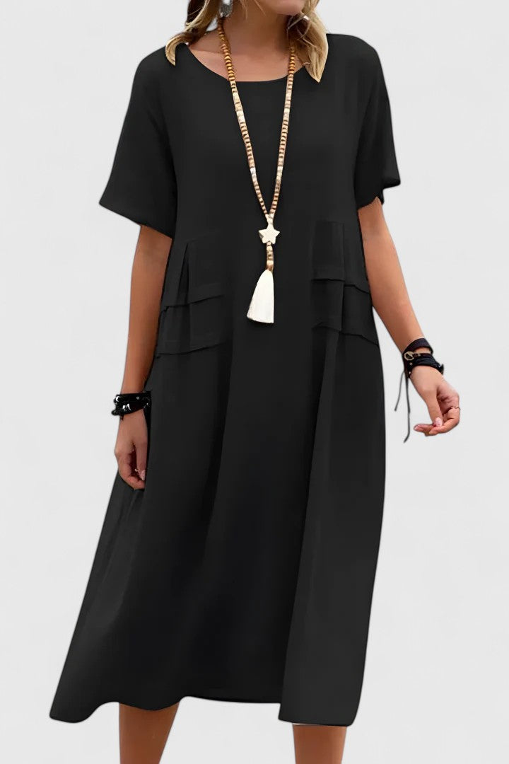 Everyday women's casual midi dress with short sleeves, loose fit, and practical pockets for summer comfort.