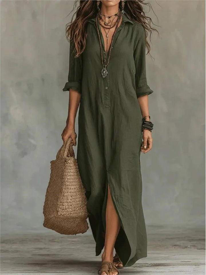 Model wearing a flowing women's summer maxi shirt dress with a collar neck and stylish side split detail.