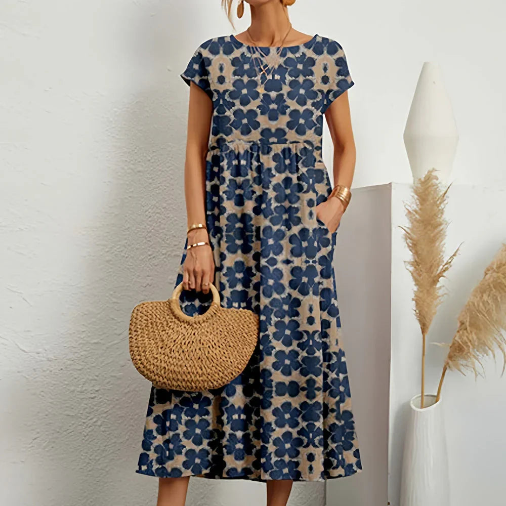 Stylish women's midi dress with delicate cap sleeves, a chic and relaxed fit for casual spring and summer days.