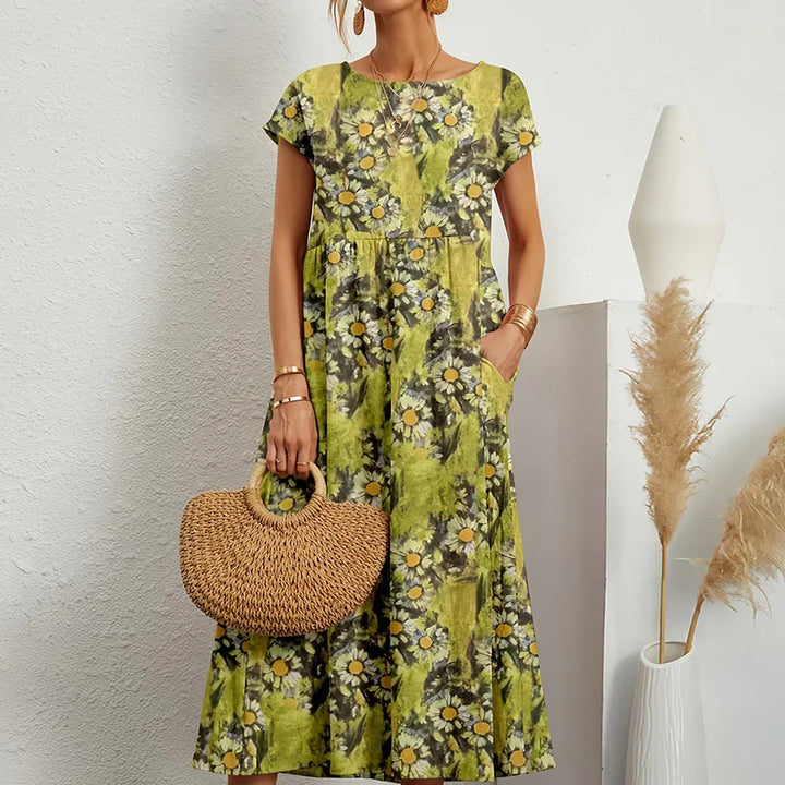 Relaxed fit women's midi dress with cap sleeves, offering comfortable, versatile everyday wear for spring/summer.
