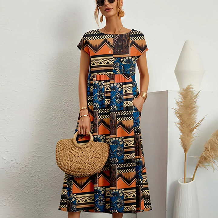 Flowing women's casual midi dress with cap sleeves, a perfect chic option for warm weather and everyday style.