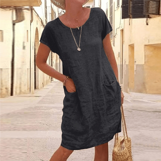 Women's casual mini dress with short sleeves, round neck & pockets for everyday summer comfort & relaxed fit.
