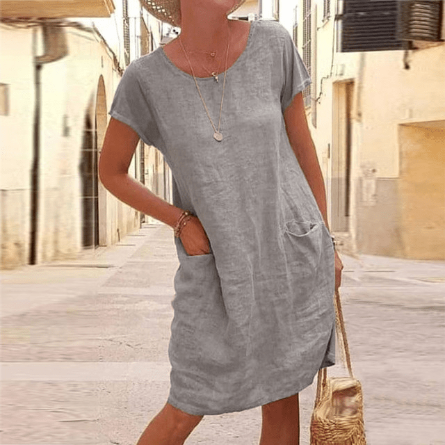 Comfortable women's summer mini dress, short sleeve, round neck. Casual pocket dress for relaxed everyday style.
