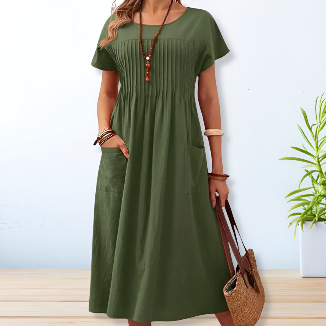 Relaxed fit women's midi dress for spring & summer. Comfortable everyday wear with a versatile casual style.