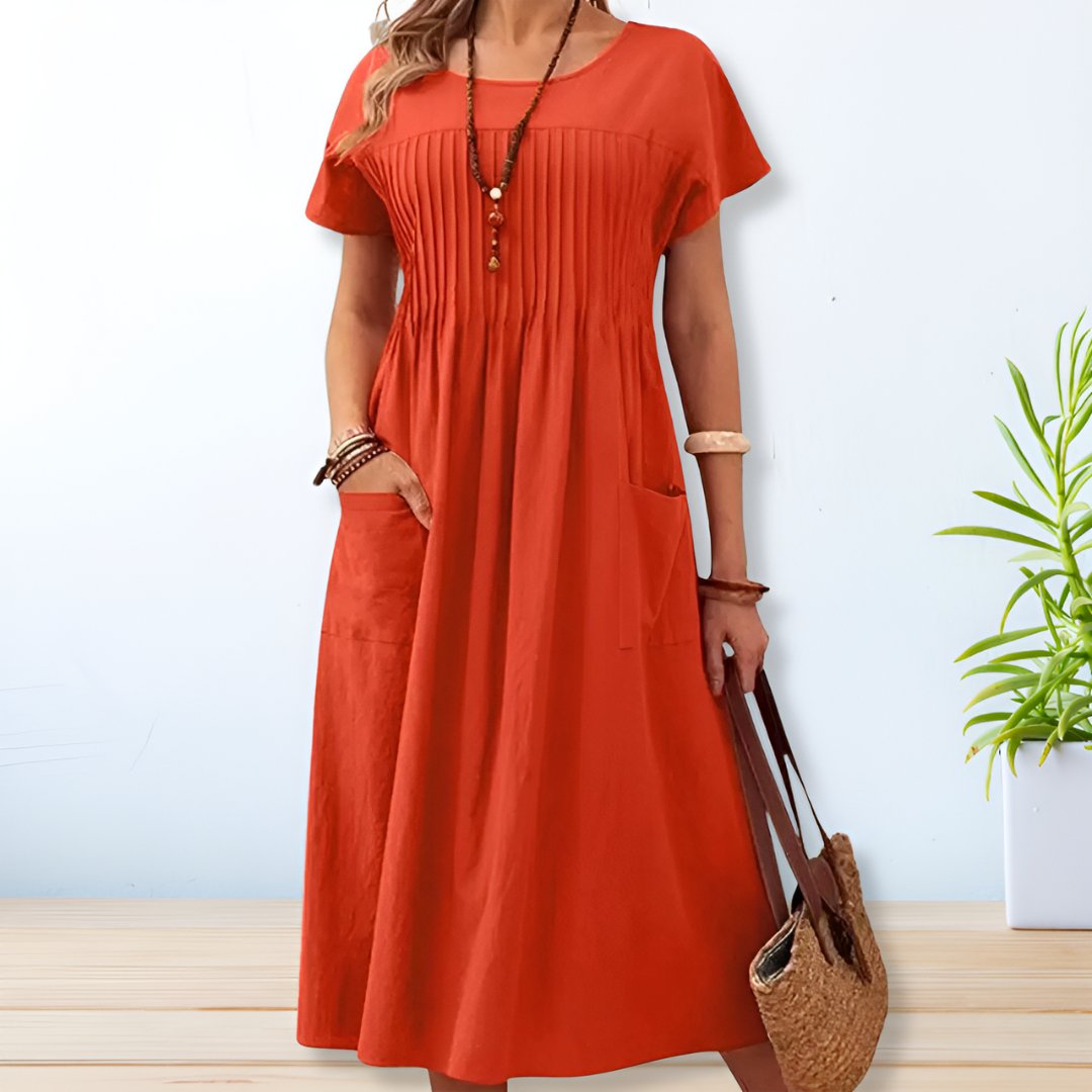 Versatile pleated midi dress for women, featuring a relaxed fit & practical pockets, ideal for casual everyday comfort.