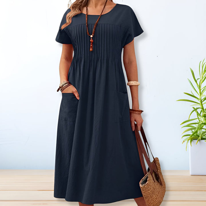 Comfortable women's casual midi dress, relaxed fit, great for everyday wear. Ideal for summer and spring fashion.