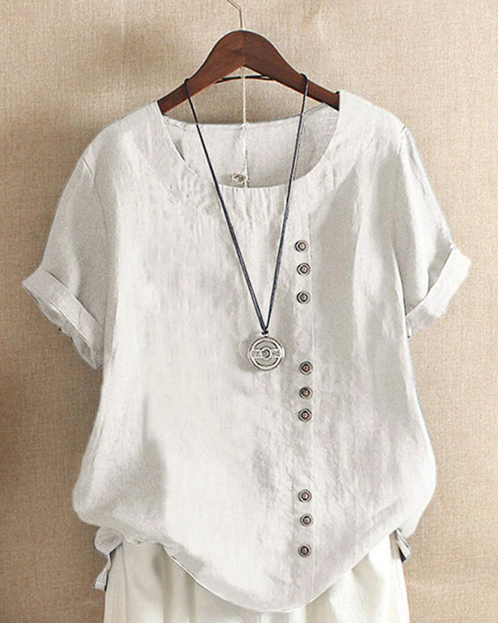 Relaxed fit women's short sleeve button-front top, chic and versatile for spring fashion.
