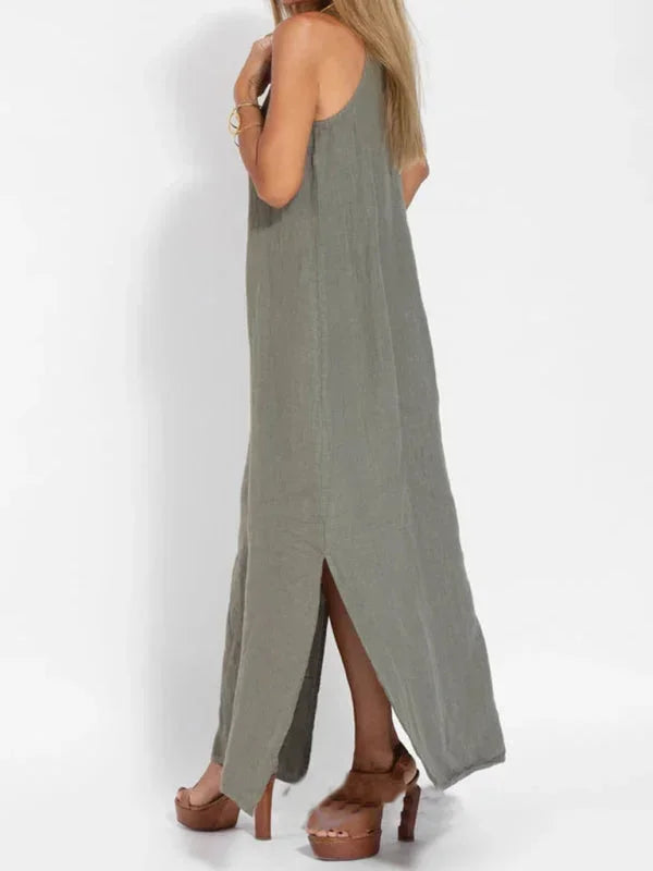 Stylish women's summer maxi dress, sleeveless with a chic side slit, ideal for beach & casual days.