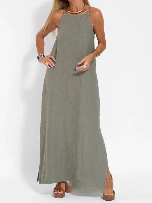 Women's vacation sleeveless maxi dress, relaxed fit & breathable, featuring a flattering side slit.
