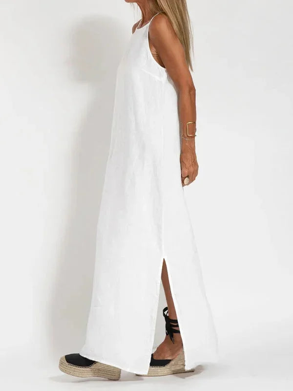 Flowy sleeveless women's maxi dress with a stylish side slit, ideal for warm weather comfort.